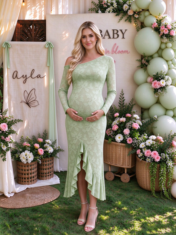 Green maternity maxi dress with an oblique shoulder neckline and falbala ruffles, featuring a flowing silhouette for baby showers