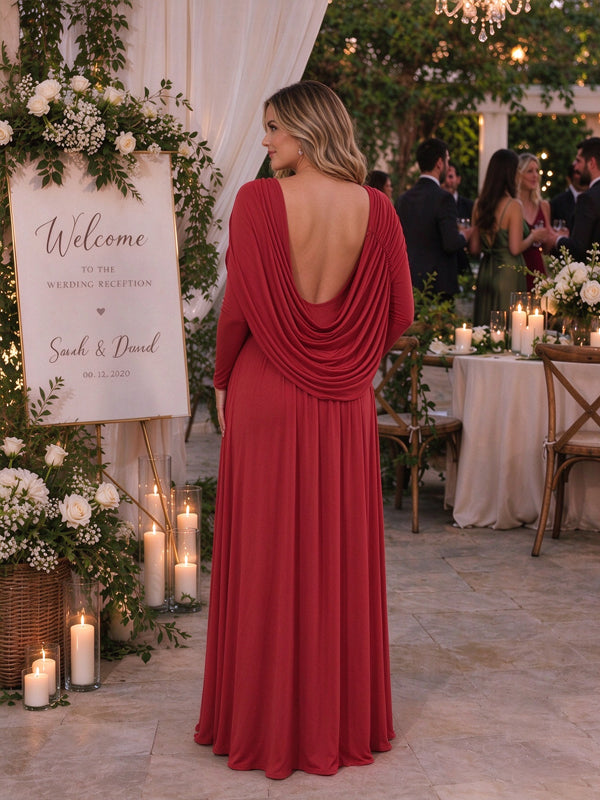 Red maternity maxi dress with a cape design, ruffle accents and a backless detail, elegant flowing fit