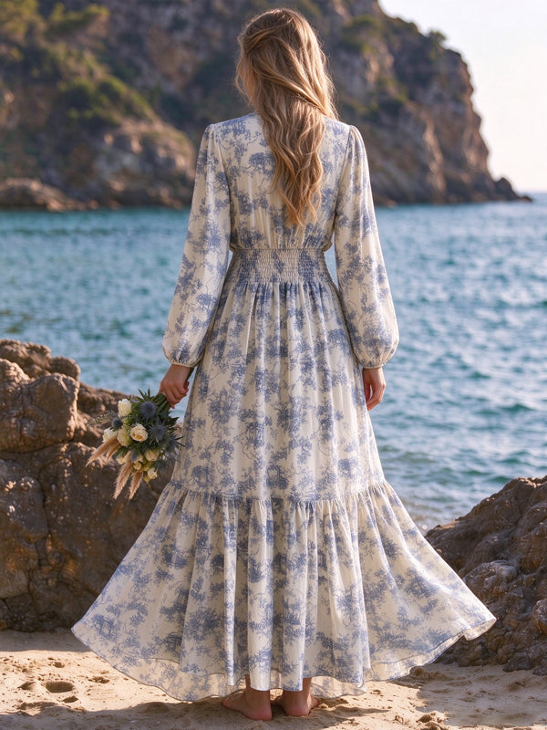 Blue printed maternity maxi dress with lantern sleeves and a high-waisted flowing fit