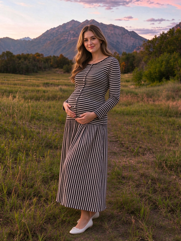 Black knitted striped maternity maxi dress with button details and a fitted silhouette, perfect for photoshoots
