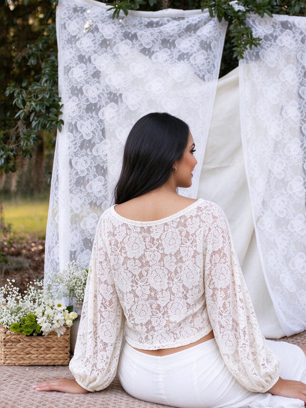 Apricot maternity lace top with a decorative twist detail and voluminous lantern sleeves, flattering fit