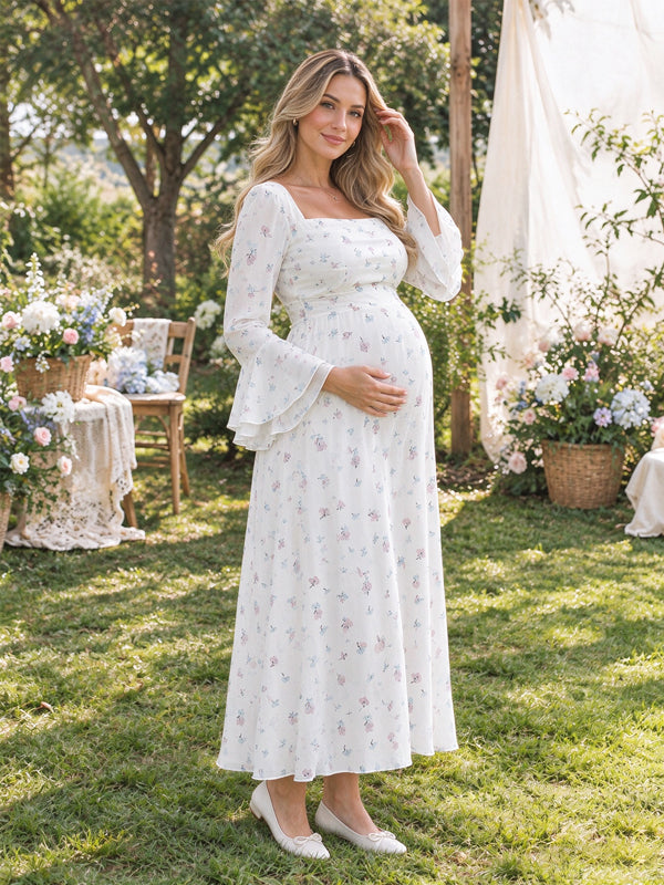 White printed maternity maxi dress with elegant flared sleeves and a relaxed flowing fit