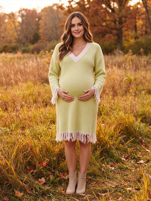 Green color-block maternity mini dress with tassel accents and a flattering silhouette, perfect for photoshoots