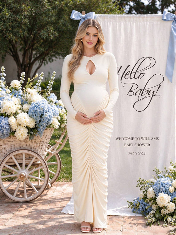 Apricot maternity dress with ruffle accents and cut-out details, featuring a flattering flowing silhouette for baby showers