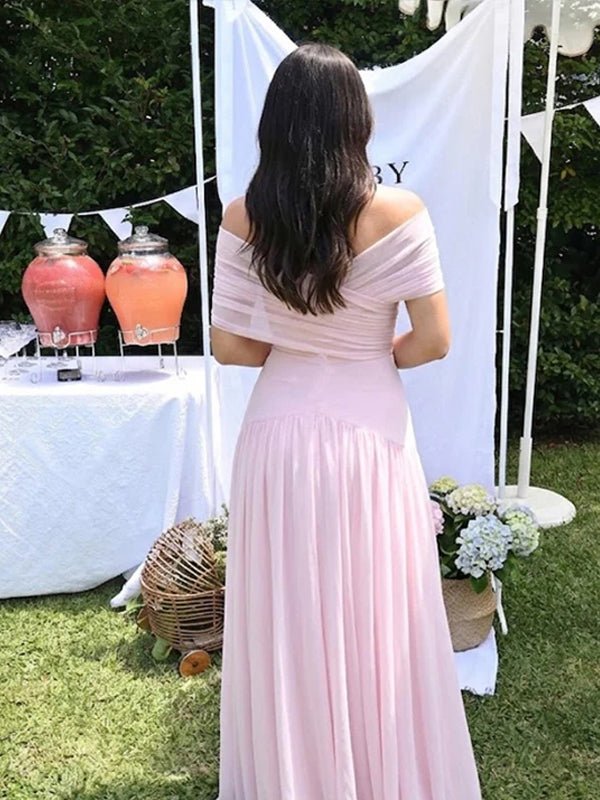 Pink maternity maxi dress with sheer fabric and flattering ruched silhouette.
