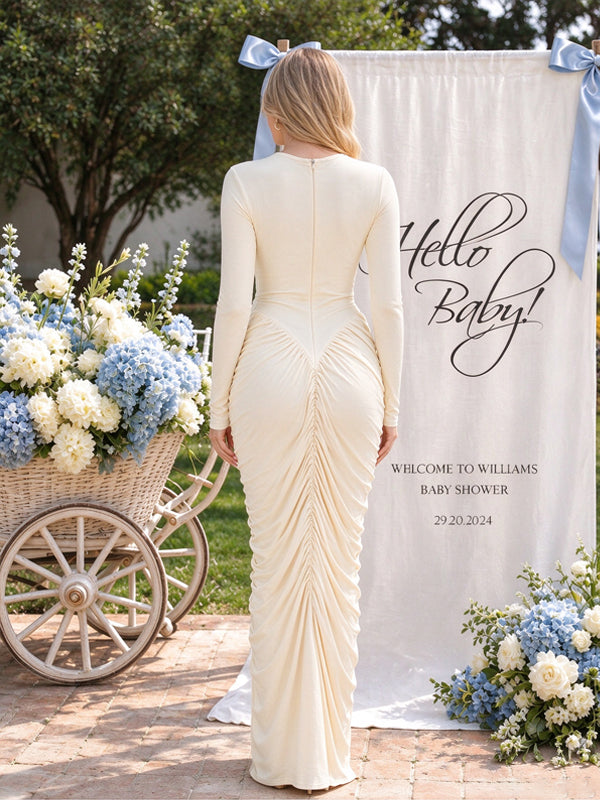 Apricot maternity dress with delicate ruffles and stylish cut-out details, elegant fitted design