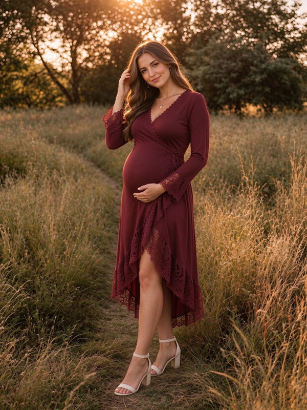 Burgundy maternity maxi dress with V-neckline, lace panel details and an asymmetrical skirt hem