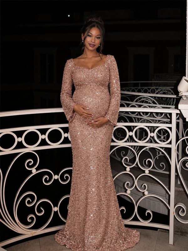 Golden sequin maternity dress with flared sleeves and an A-line silhouette, featuring a sparkling finish for photoshoots