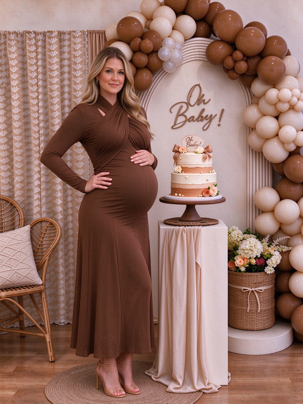 Brown maternity maxi dress with a cross-chest neckline and layered ruffle accents
