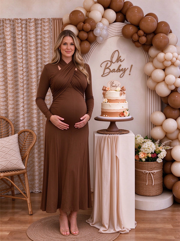 Brown maternity maxi dress with a cross-chest design and ruffle accents, featuring a flowing silhouette for baby showers