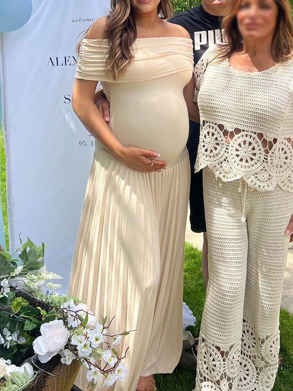 Apricot maternity maxi dress with off-shoulder ruched pleated design and big swing silhouette, designed for baby shower.