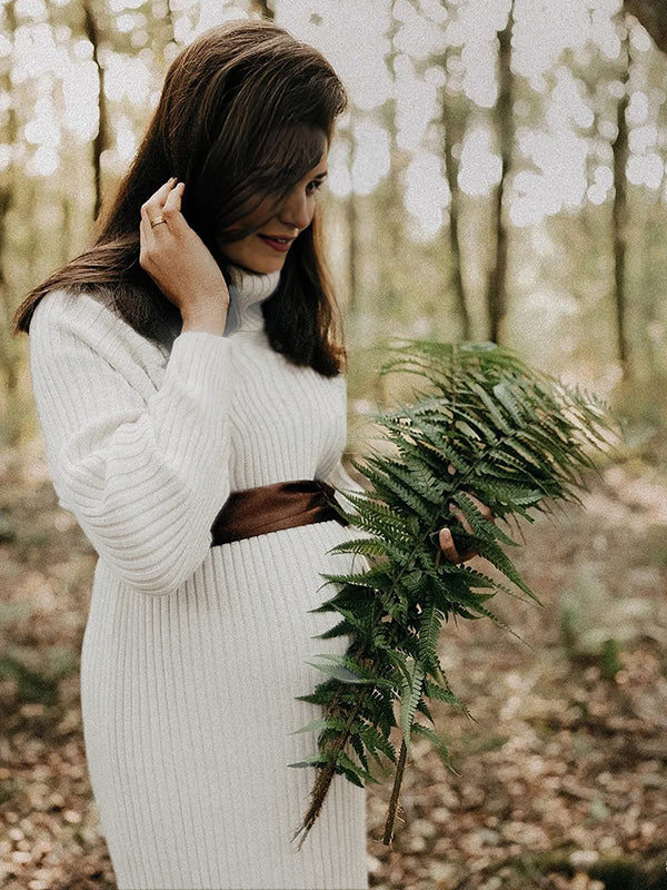 white sweater maxi dress Momyknows White High Neck Side Slit Crochet Maternity Photoshoot Sweater Maxi Dress