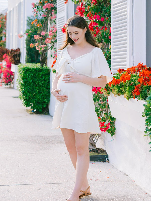 maternity vacation dresses Momyknows Elegant White Knot A-Line Flowy Vacation Photoshoot Maternity Mini Dress White / M