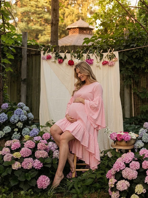 Soft Pink High-Low Ruffled Maternity Dress with Dramatic Bell Sleeves Garden Photoshoot
