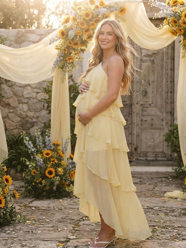 Light yellow maternity maxi dress with halter neck, falbala ruffle and lace-up backless design.