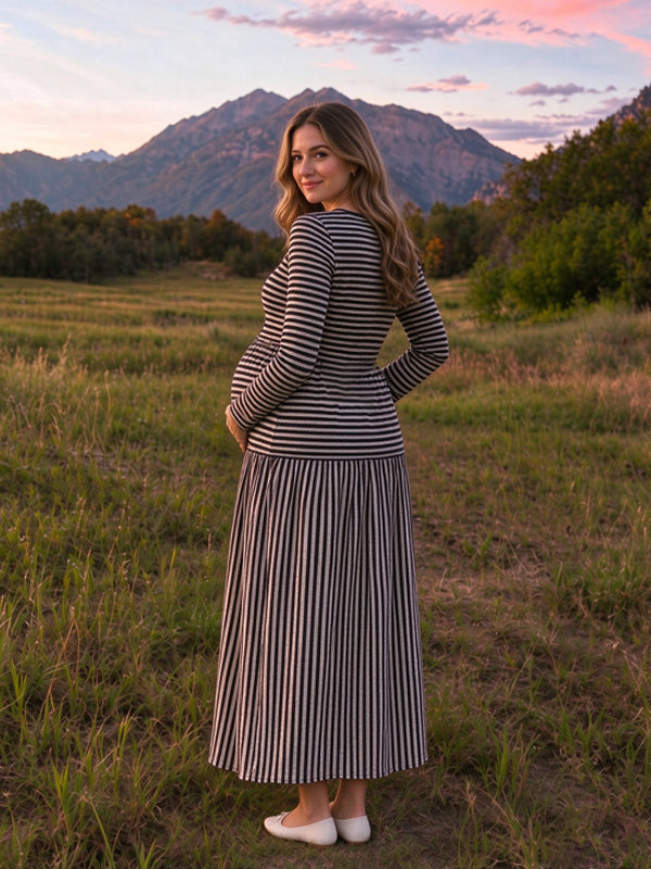 Black knitted maternity maxi dress with striped patterns and front button details, flattering fitted style
