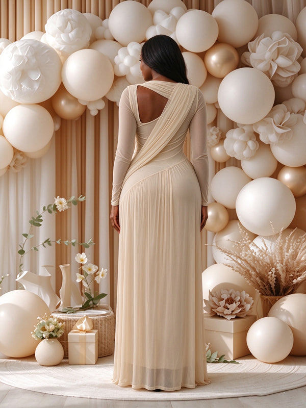 Apricot maternity dress with mesh fabric, delicate pleats and an open-back design, flattering flowing fit