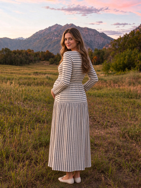 Apricot knitted maternity maxi dress with striped patterns and front button details, flattering fitted style