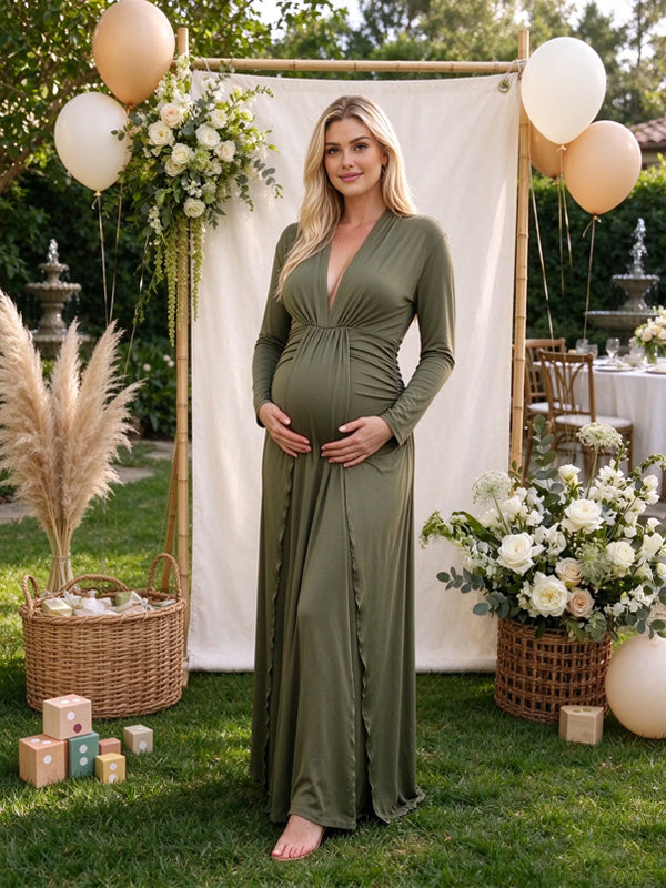Green maternity dress with a deep V-neckline and front knot detail, featuring a flowing ruffle silhouette for baby showers