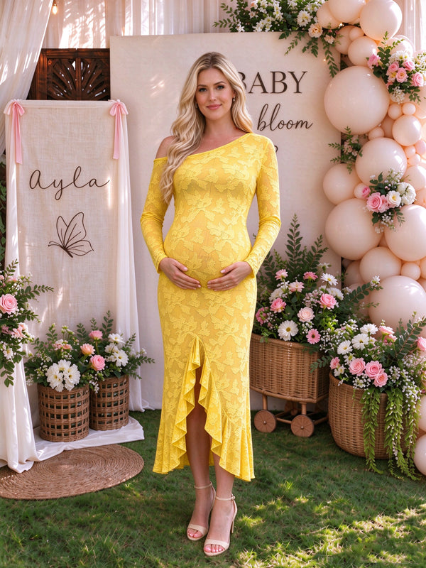 Yellow maternity maxi dress with an oblique shoulder neckline and falbala ruffles, featuring a flowing silhouette for baby showers